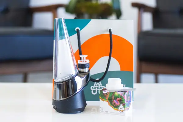 Device on a table with a shopping bag