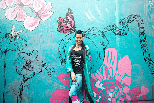 Katie Brightside in front of her mural at The Mondrian Hotel on Sunset Blvd, in West Hollywood, CA