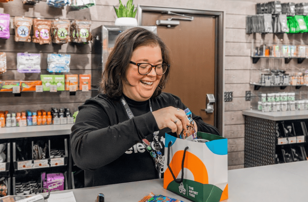 woman selling cannabis in shop